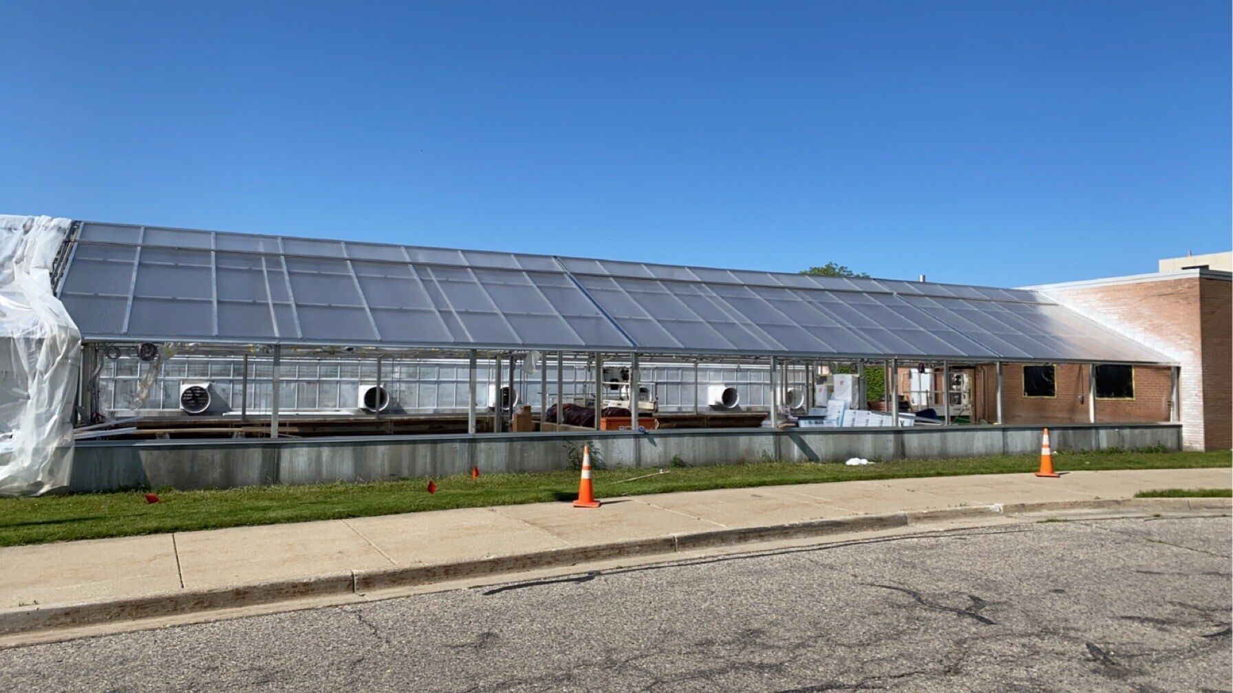 MSU plant science greenhouse with new roof covering.
